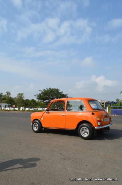 mini cooper in action rear side profle